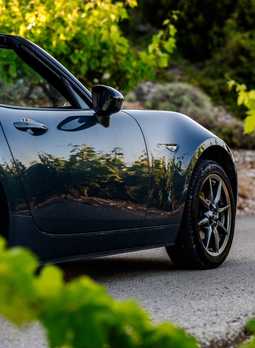 Mazda MX-5 parked beside a stone wall on Pelješac